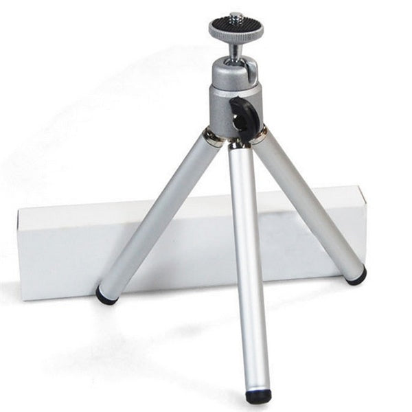 1080P LED Mini High Definition Projector on a small tripod for stable viewing and enhanced projection performance.