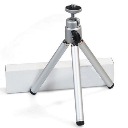 1080P LED Mini High Definition Projector on a small tripod for stable viewing and enhanced projection performance.